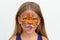 Portrait child with tiger face painting with gnarling facial expression