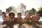 Portrait Of Children Having Fun In Outdoor Swimming Pool