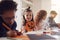 Portrait Of Children At Home With Friends Having Fun Making Halloween Decorations Together