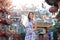 Portrait of Chinese woman wear traditional dress cheongsam and holding fan at chinese shrine in chinese new year, China Girl