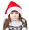 Portrait christmas girl in red santa hat. isolated on white