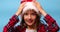 Portrait of Christmas little Girl in Santa Hat, joyful, smiling child