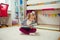 Portrait of clever little girl reading book at home