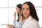 Portrait close up Hispanic woman Smiling female call center operator with headset desktop computer