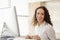 Portrait close up Hispanic woman Smiling female call center operator with headset desktop computer