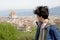 Portrait close up of a male teenager with the city of Florence on the background with copy space for your text