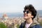 Portrait close up of a male teenager with the city of Florence on the background with copy space for your text