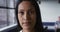 Portrait close up of mixed race businesswoman looking at camera and smiling in office