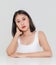 Portrait close up studio shot of millennial Asian short black hair model wearing makeup red lip in tank top undershirt sitting at