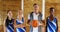Portrait of coach and schoolkids standing with basketball 4k