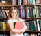 Portrait of a college student in library