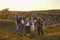 Portrait of a company of young friends of boys and girls hiking in the mountainous countryside.