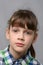 Portrait of a compassionate ten-year-old girl of European appearance, close-up
