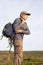 Portrait of concentrated elderly man with backpack