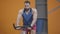 Portrait of concentrated muscular Middle Eastern man riding exercise bike in gym. Confident strong sportsman exercising