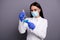 Portrait of concentrated scientist woman work in lab make new vaccine analyze chemical blue liquid hold flask wear white