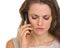 Portrait of concerned woman talking mobile phone