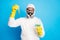 Portrait of confident chemist in white hazmat suit hold test-tube experimental vaccine covid infection wear yellow latex