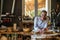 Portrait of confident craftswoman in her workshop