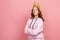 Portrait of confident curly haired teenage girl in hoodie with gold crown on head crossing hands and looking at camera, I am queen