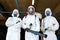 Portrait of confident disinfectants with sprayers