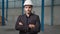 Portrait confident factory manager wearing suit and safety helmet