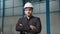 Portrait confident factory manager wearing suit and safety helmet