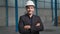 Portrait confident factory manager wearing suit and safety helmet