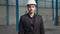 Portrait confident factory manager wearing suit and safety helmet