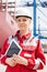 Portrait of confident female engineer holding tablet computer in shipping yard