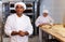 Portrait of confident latino chef in bakery