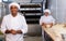 Portrait of confident latino chef in bakery