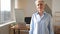 Portrait of confident stylish european middle aged senior woman at workplace. Stylish older mature 60s gray haired lady