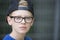 Portrait confident teenage boy with cap