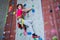 Portrait of confident teenage girl practicing rock climbing