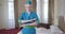 Portrait of confident woman in blue stewardess uniform posing in hotel room. Elegant beautiful Caucasian lady crossing