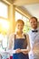 Portrait of confident young staff standing at restaurant