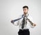 Portrait of a confused young bearded man in white shirt choosing right necktie