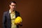 Portrait of construction businessman with hardhat against brown background