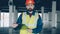 Portrait of construction specialist standing in workplace with papers and looking at camera