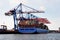 Portrait of a containership loaded with containers lying at a dock in the Port of Hamburg