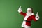 Portrait of cool Santa Claus on color background