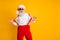 Portrait of cool stylish santa claus hipster enjoy newyear time magic festive celebration pull suspenders wear red hat