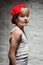 Portrait of cool young hip hop boy in red hat and red pants