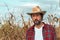 Portrait of corn farmer in ripe maize crop field