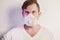 Portrait of a coronavirus infected young man in a medical mask,