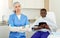 Portrait of cosmetician woman preparing to medicine procedure with man in clinic