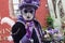 Portrait of Costumed woman with purple dress at the Venetian Parade in Riquewihr in Alsace