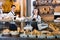 Portrait of couple at bakery display with pastry