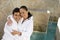 Portrait Of A Couple In Bathrobe Smiling